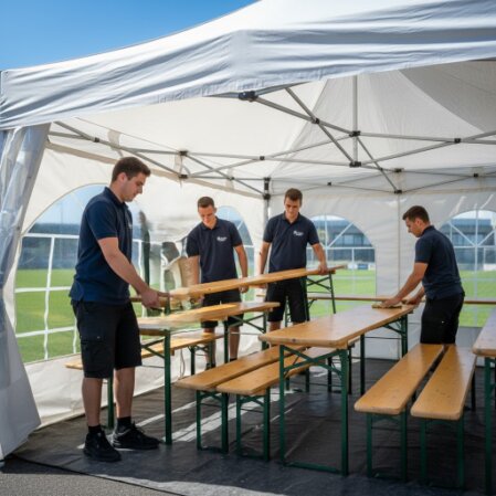 Ekipa techniczna montująca strefę eventową